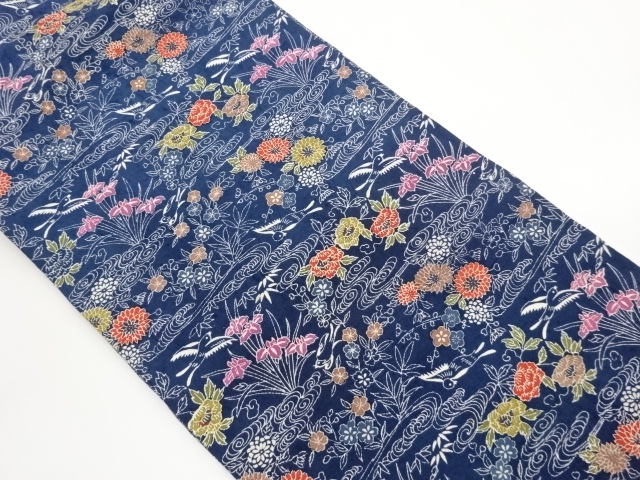 Nagoya obi, hand-woven tsumugi pongee with floral leaves, rough waves, and bird